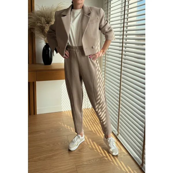 Eleganckie Spodnie dresowe Vulcano w kolorze kremowe latte